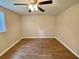Bedroom featuring window, ceiling fan and hardwood flooring at 3975 N Sharon Church N Rd, Loganville, GA 30052