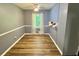 Charming dining area with modern light fixture and scenic outdoor view at 3975 N Sharon Church N Rd, Loganville, GA 30052