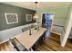 Charming dining room with natural light and view into updated kitchen at 3975 N Sharon Church N Rd, Loganville, GA 30052