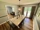 Bright dining room featuring natural light, chandelier, and view to living room at 3975 N Sharon Church N Rd, Loganville, GA 30052