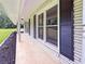 Covered entryway featuring white brick, dark shutters and manicured landscaping at 3975 N Sharon Church N Rd, Loganville, GA 30052