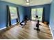 Flex room featuring wood floors, natural light, and space for a workout area at 3975 N Sharon Church N Rd, Loganville, GA 30052