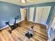 Flex room featuring wood floors, natural light, and space for exercise equipment at 3975 N Sharon Church N Rd, Loganville, GA 30052