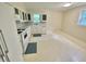 Kitchen with white appliances, cabinets, countertops and a window for natural light at 3975 N Sharon Church N Rd, Loganville, GA 30052