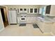 Bright kitchen featuring white appliances, cabinets and countertops with a window for natural light at 3975 N Sharon Church N Rd, Loganville, GA 30052