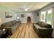 Inviting living room featuring matching sofas, neutral walls, and bright natural light at 3975 N Sharon Church N Rd, Loganville, GA 30052