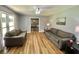 Cozy living room with hardwood floors and large windows for natural light at 3975 N Sharon Church N Rd, Loganville, GA 30052