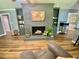 Inviting living room with fireplace, wood floors, and built-in bookshelves at 3975 N Sharon Church N Rd, Loganville, GA 30052
