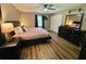 Bright main bedroom with wood floors, neutral paint, and a large window for natural light at 3975 N Sharon Church N Rd, Loganville, GA 30052