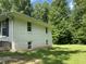 Side view of a well-maintained home featuring manicured landscaping and an attractive, classic design at 3975 N Sharon Church N Rd, Loganville, GA 30052