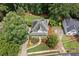Aerial view of a home showcasing its well-manicured lawn, mature trees, and proximity to neighboring properties at 526 Summer Ter, Woodstock, GA 30189