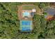 Community amenities including a sparkling pool, tennis courts, and surrounding lush greenery as seen from above at 526 Summer Ter, Woodstock, GA 30189