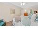 Comfortable primary bedroom with ceiling fan and a bright window at 526 Summer Ter, Woodstock, GA 30189