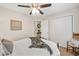 Cozy bedroom featuring a ceiling fan and plush carpeting at 526 Summer Ter, Woodstock, GA 30189