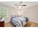Bedroom featuring a ceiling fan and bright, natural light at 526 Summer Ter, Woodstock, GA 30189