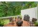 Outdoor deck area with comfortable seating and a grill, perfect for relaxing and entertaining guests at 526 Summer Ter, Woodstock, GA 30189