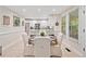 Eat-in kitchen with table set for dinner, stainless appliances, and ample natural light at 526 Summer Ter, Woodstock, GA 30189