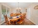 Traditional dining room with wood table set and chandelier at 526 Summer Ter, Woodstock, GA 30189