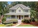 Charming two-story home with a welcoming front porch and beautifully landscaped front yard at 526 Summer Ter, Woodstock, GA 30189