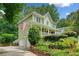 Charming two-story home with a welcoming front porch, landscaped yard, and a two-car garage at 526 Summer Ter, Woodstock, GA 30189