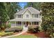 Charming two-story home with a welcoming front porch and beautifully landscaped front yard at 526 Summer Ter, Woodstock, GA 30189
