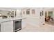 Spacious kitchen with a wine fridge, granite counters, and stainless appliances at 526 Summer Ter, Woodstock, GA 30189