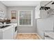Functional laundry room with front load washer, dryer, and sink at 526 Summer Ter, Woodstock, GA 30189