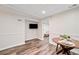 Relaxing living area with wood flooring, table with seating for two at 526 Summer Ter, Woodstock, GA 30189