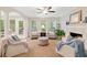 Comfortable living room featuring an inviting fireplace and ample natural light at 526 Summer Ter, Woodstock, GA 30189