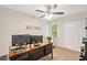 Office with large wooden desk, dual monitors, and good natural lighting at 526 Summer Ter, Woodstock, GA 30189