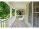 Relaxing front porch with a classic swing, perfect for enjoying the outdoors at 526 Summer Ter, Woodstock, GA 30189