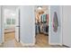 Large walk-in closet with custom shelving and hanging space at 526 Summer Ter, Woodstock, GA 30189