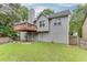 Expansive backyard with a walk-out patio and a wood deck, perfect for entertaining at 571 Oak Vista Ct, Lawrenceville, GA 30044