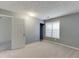 Grey bedroom with carpet, closet, and window with blinds at 571 Oak Vista Ct, Lawrenceville, GA 30044