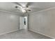 Neutral bedroom featuring a ceiling fan, closet, and plush carpet at 571 Oak Vista Ct, Lawrenceville, GA 30044