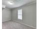 Neutral bedroom with carpet and window with blinds at 571 Oak Vista Ct, Lawrenceville, GA 30044