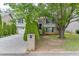 Traditional two-story home with a brick facade, a manicured lawn, and mature landscaping at 571 Oak Vista Ct, Lawrenceville, GA 30044