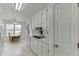 Bright kitchen features white cabinets, appliances and eat-in breakfast nook at 571 Oak Vista Ct, Lawrenceville, GA 30044