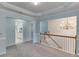 Open living space with staircase view, chandelier, and access to the kitchen at 571 Oak Vista Ct, Lawrenceville, GA 30044