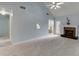 Open-concept living room featuring a fireplace, carpet flooring, and a view of the breakfast area at 571 Oak Vista Ct, Lawrenceville, GA 30044