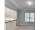 Upstairs living area with crown molding, carpet, and chandelier view at 571 Oak Vista Ct, Lawrenceville, GA 30044