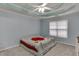 Spacious main bedroom with tray ceiling and neutral carpeting at 571 Oak Vista Ct, Lawrenceville, GA 30044