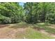 The backyard is tree-lined, offering shade, privacy and lots of room at 6906 Shangrila Way, Riverdale, GA 30296