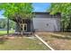 Backyard of the house features a porch, a covered deck, and room for lawn at 6906 Shangrila Way, Riverdale, GA 30296