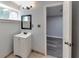 Bathroom featuring a modern vanity with sink, mirror, and updated light fixture at 6906 Shangrila Way, Riverdale, GA 30296