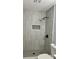 Modern bathroom featuring stylish tile, a walk-in shower with a rainfall showerhead, and sleek fixtures at 6906 Shangrila Way, Riverdale, GA 30296