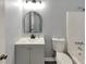 Bathroom featuring a modern vanity, new toilet and shower-tub combination at 6906 Shangrila Way, Riverdale, GA 30296
