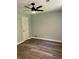 Spacious bedroom with new floors, a modern ceiling fan, fresh paint, and a bright and airy feel at 6906 Shangrila Way, Riverdale, GA 30296