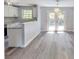 Stylish kitchen features white cabinets, granite countertops, and stainless steel appliances at 6906 Shangrila Way, Riverdale, GA 30296