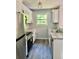 Contemporary kitchen featuring white cabinets, granite countertops, stainless steel appliances, and modern fixtures at 6906 Shangrila Way, Riverdale, GA 30296